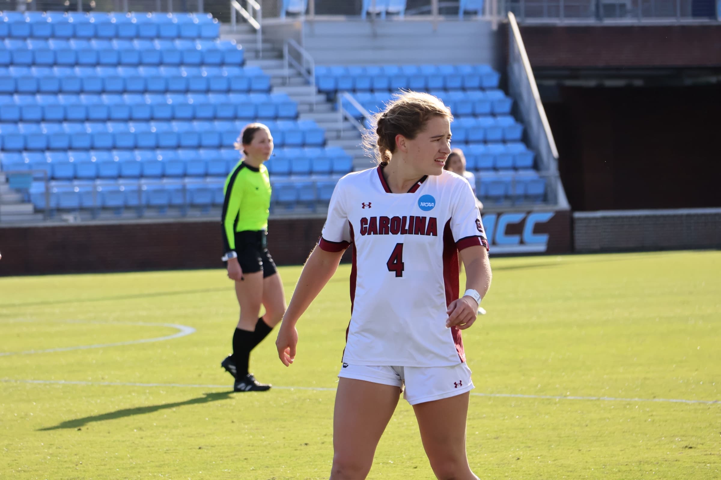 A South Carolina midfielder in an NCAA tournament game, looking back over her shoulder